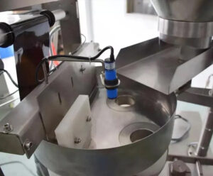 Детали упаковочной машины с задним уплотнением - измерение объемного стакана